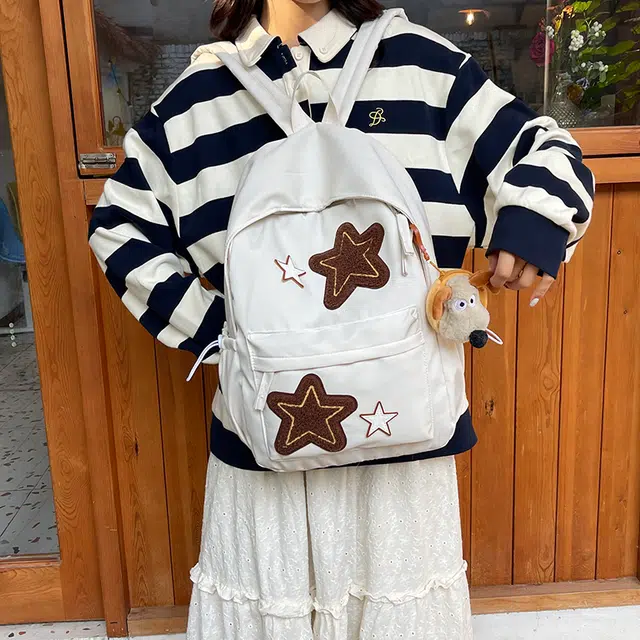 泰格奴 小清新休闲高颜值精美星星韩版背包初中生高中生大学生上课百搭书包 尼龙 双肩包 常规 女款 白色/黄色/蓝色/桔色/黑色