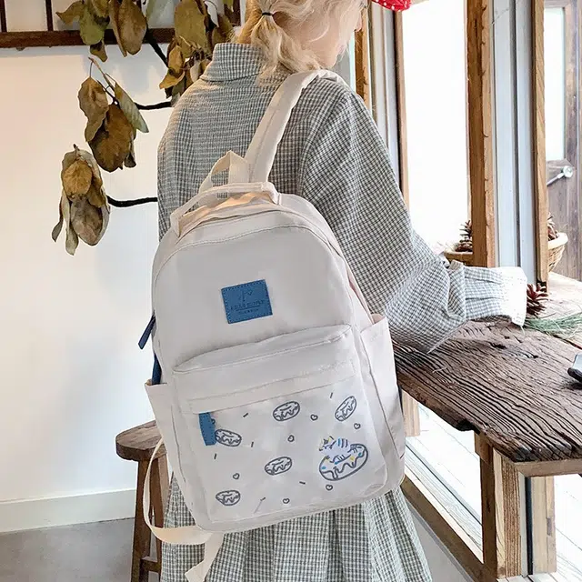 泰格奴 涂鸦精美机能通勤旅行小清新轻便高颜值大容量背包初中高中大学生上课百搭书包 尼龙布 双肩包 女款 米白色