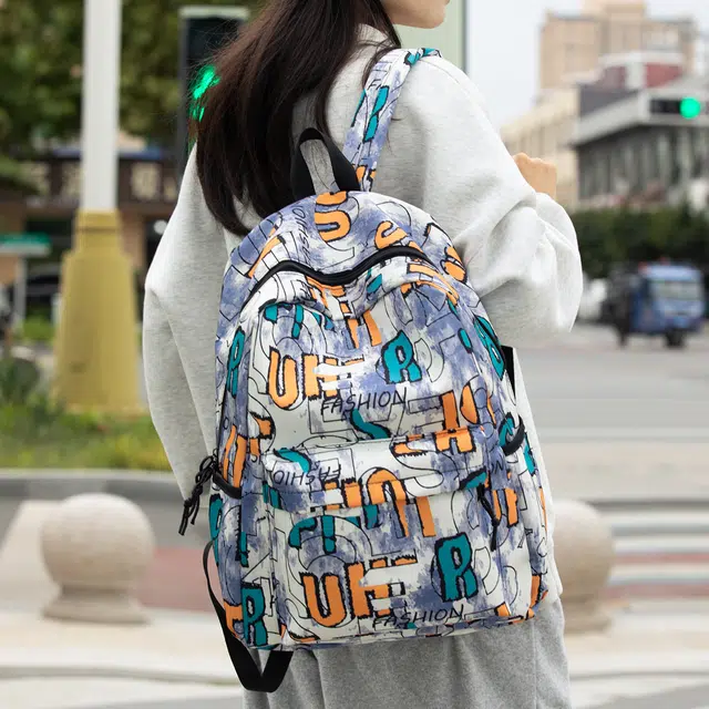 泰格奴 字母印花轻便简约大容量运动耐磨背包初中生高中生大学生上课百搭书包 尼龙 双肩包 男女同款情侣款 卡其色/紫色/蓝色/黑色