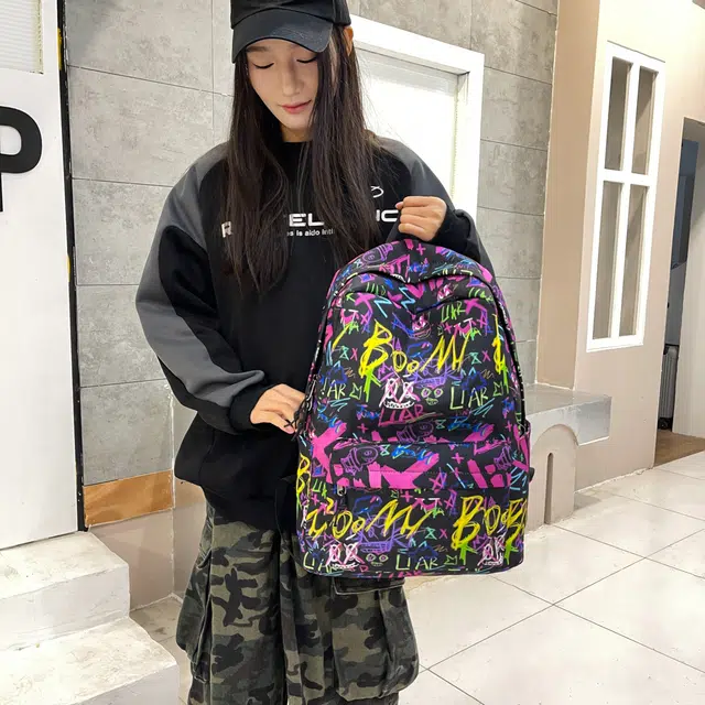 泰格奴 涂鸦精美机能通勤旅行轻便高颜值潮流百搭大容量背包初中高中大学生上课百搭书包 牛津布 双肩包 男女同款情侣款 紫色/黑色/蓝色