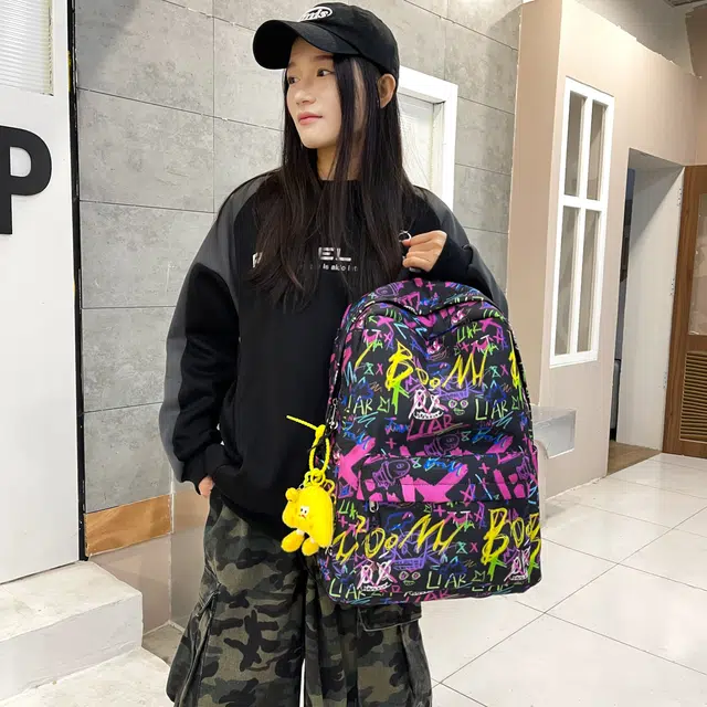 泰格奴 涂鸦精美机能通勤旅行轻便高颜值潮流百搭大容量背包初中高中大学生上课百搭书包 牛津布 双肩包 男女同款情侣款 紫色/黑色/蓝色