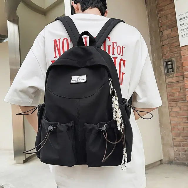 泰格奴 美式报纸涂鸦高级感潮流高街大容量背包初高中大学生上课书包 尼龙 双肩包 男女同款情侣款 黑色/粉红色/卡其色/绿色