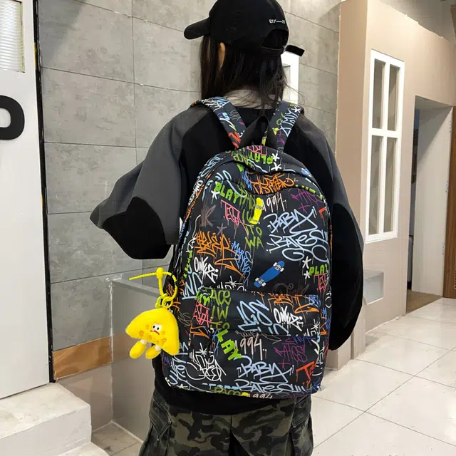 泰格奴 字母印花轻便简约国风大容量运动耐磨背包初中生高中生大学生上课百搭书包 尼龙布 双肩包 男女同款情侣款 蓝色/黑色