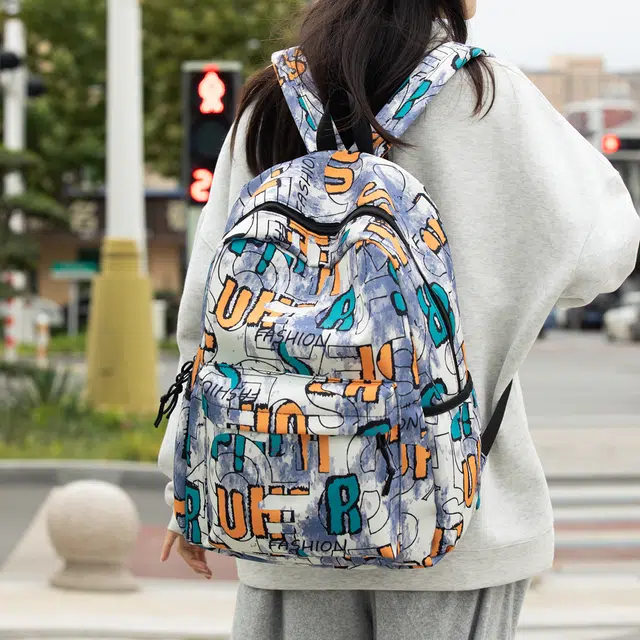 泰格奴 字母印花轻便简约大容量运动耐磨背包初中生高中生大学生上课百搭书包 尼龙 双肩包 男女同款情侣款 卡其色/紫色/蓝色/黑色