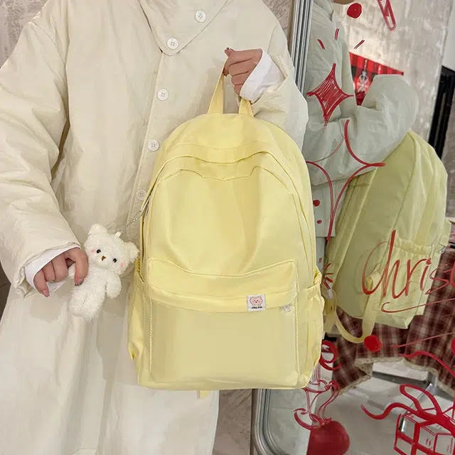 泰格奴 小清新休闲高颜值精美潮版韩版背包初中生高中生大学生上课百搭书包 尼龙 双肩包 常规 女款 浅黄色粉色