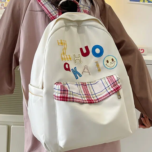 泰格奴 字母印花轻便简约国风大容量运动耐磨背包初中生高中生大学生上课百搭书包 尼龙 双肩包 女款 白色绿色黄色蓝色