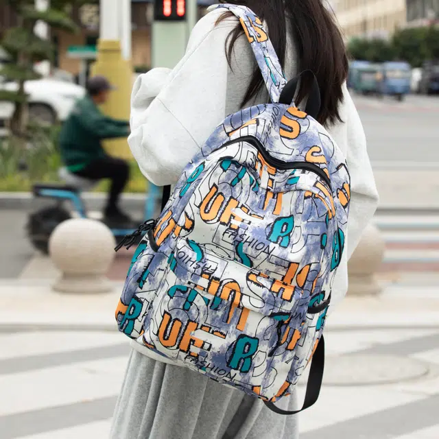 泰格奴 字母印花轻便简约大容量运动耐磨背包初中生高中生大学生上课百搭书包 尼龙 双肩包 男女同款情侣款 卡其色/紫色/蓝色/黑色