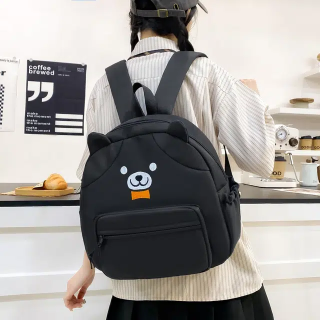 泰格奴  时尚简约日系高颜值可爱大容量卡通小熊高中生大学生书包小清新旅游出游  尼龙 双肩包 男女同款情侣款 黑色/黄色/白色