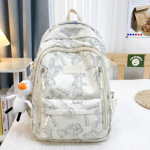 泰格奴 印花轻便简约大容量运动耐磨背包初中生高中生大学生上课百搭书包 尼龙 双肩包 男女同款情侣款 米白色/黑色/紫色/绿色