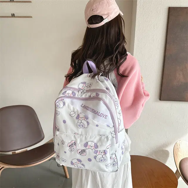 泰格奴 涂鸦精美通勤旅行小清新轻便高颜值大容量背包初中高中大学生上课百搭书包 牛津布 双肩包 女款 紫罗兰/湖蓝色/黄色/棕色