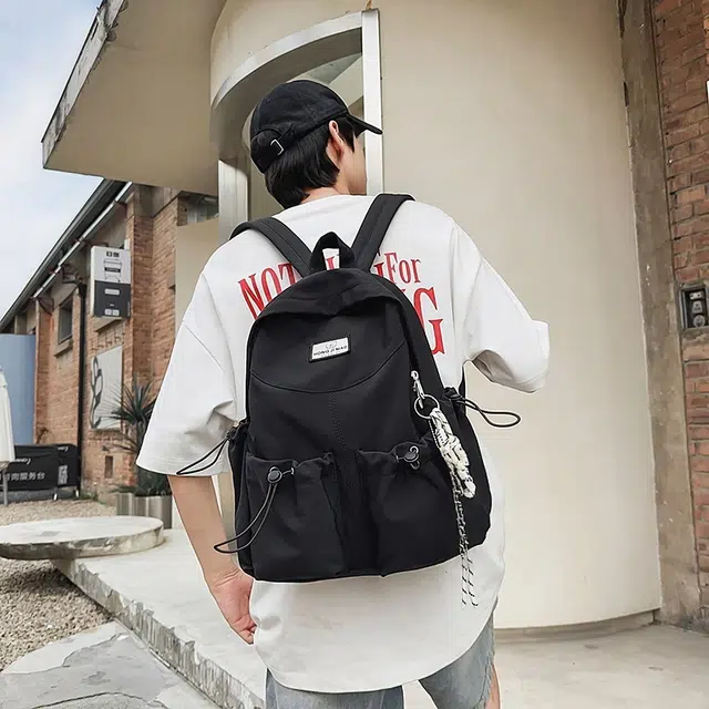 泰格奴 美式报纸涂鸦高级感潮流高街大容量背包初高中大学生上课书包 尼龙 双肩包 男女同款情侣款 黑色/粉红色/卡其色/绿色