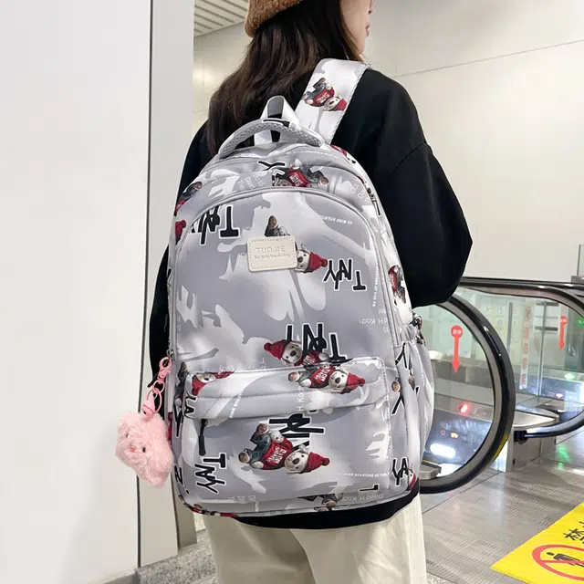 泰格奴 涂鸦精美旅行小清新轻便高颜值大容量背包初中高中大学生上课百搭书包 尼龙 双肩包 常规 男女同款情侣款 灰色/蓝色/黑色