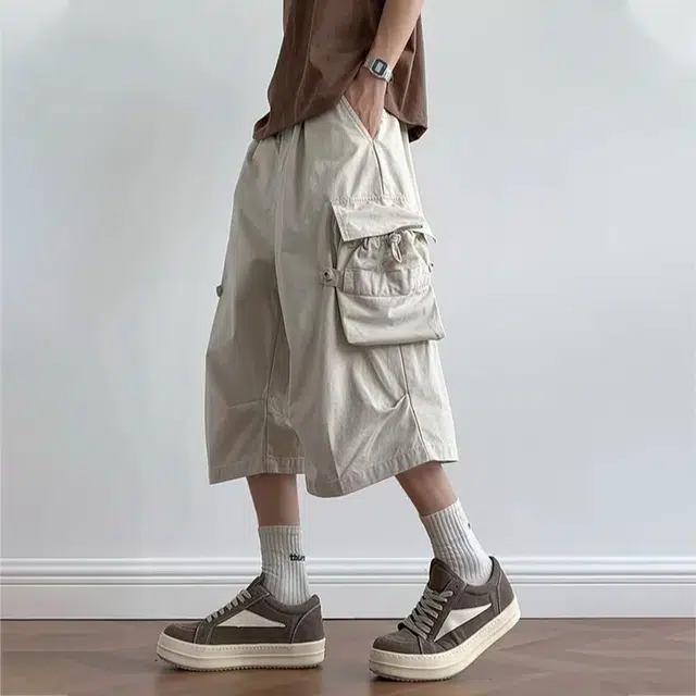 冈哉 褶皱拼接多口袋飘带设计美式高街户外运动宽松阔腿五分裤日常通勤高级感休闲短裤 男女同款