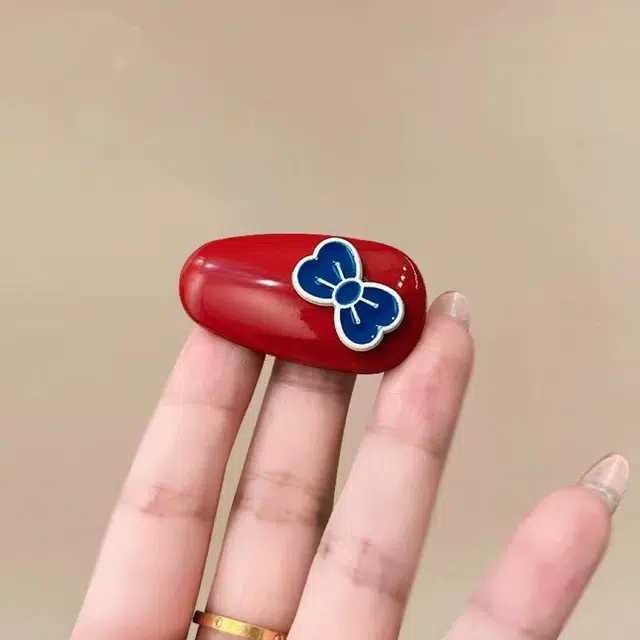 希铃 红蓝蝴蝶结椭圆前额碎发#好运 亚克力 发夹 女款