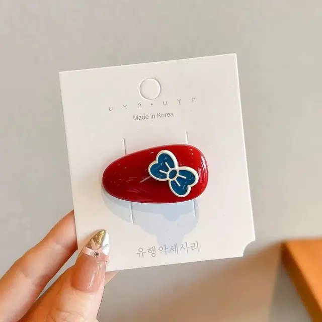 希铃 红蓝蝴蝶结椭圆前额碎发#好运 亚克力 发夹 女款