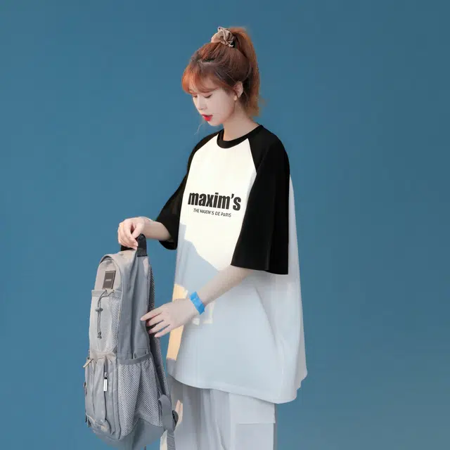 maxim's de paris logoT