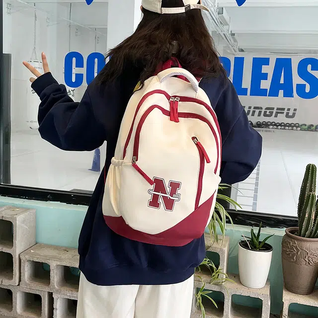南潇湘 撞色系轻便百搭背包个性气质高级感潮流时尚初中高中大学生上课书包 尼龙 双肩包 男女同款情侣款 红色/蓝色/红配蓝/黑色