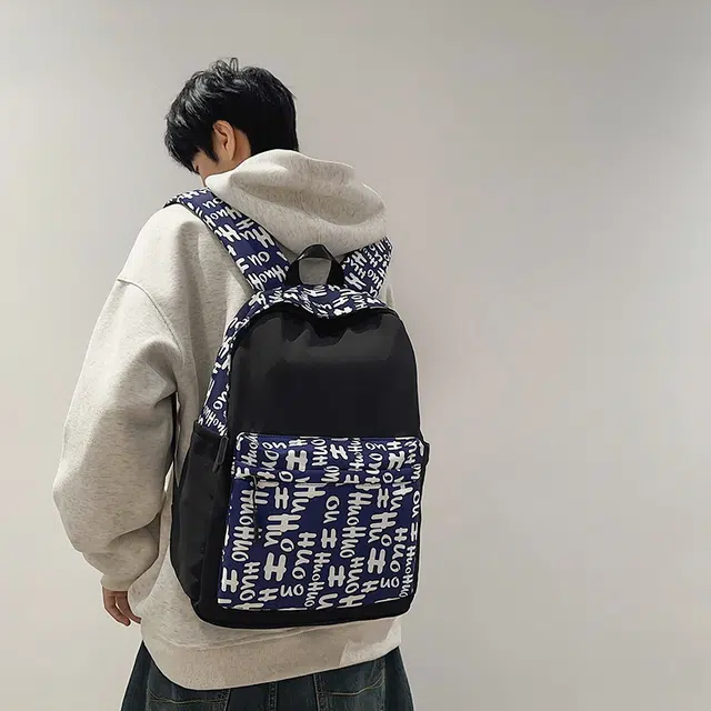 南潇湘 小清新休闲高颜值精美潮版韩版背包初中生高中生大学生上课百搭书包 尼龙 双肩包 男女同款情侣款 蓝色/红色/黑色/花色