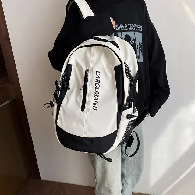 南潇湘 暗黑系工装风街拍复古简约日系纯色通勤旅行轻便高颜值上课百搭 尼龙布 双肩包 常规 男女同款情侣款 白色/黑色