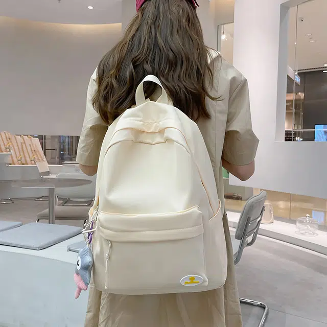 南潇湘 小清新休闲高颜值精美潮版韩版高颜值女生背包初高中生大学生上课百搭书包 尼龙 双肩包 常规 男女同款情侣款 米白色/浅绿色