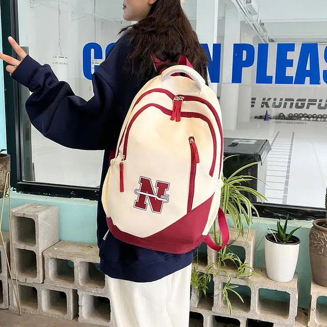 南潇湘 撞色系轻便百搭背包个性气质高级感潮流时尚初中高中大学生上课书包 尼龙 双肩包 男女同款情侣款 红色/蓝色/红配蓝/黑色