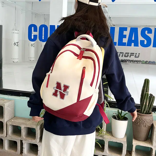 南潇湘 撞色系轻便百搭背包个性气质高级感潮流时尚初中高中大学生上课书包 尼龙 双肩包 男女同款情侣款 红色/蓝色/红配蓝/黑色