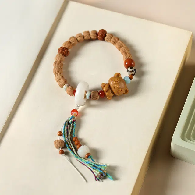 茂琼 吉祥如意新中式国潮时尚复古设计潮流百搭百民族风格配饰可爱小熊藏式流苏挂件 柏香籽/百香籽 菩提类手串 女款