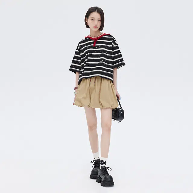 SHUEN T