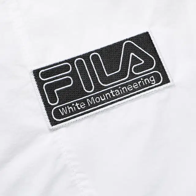 FILA FUSION x White Mountaineering Logo