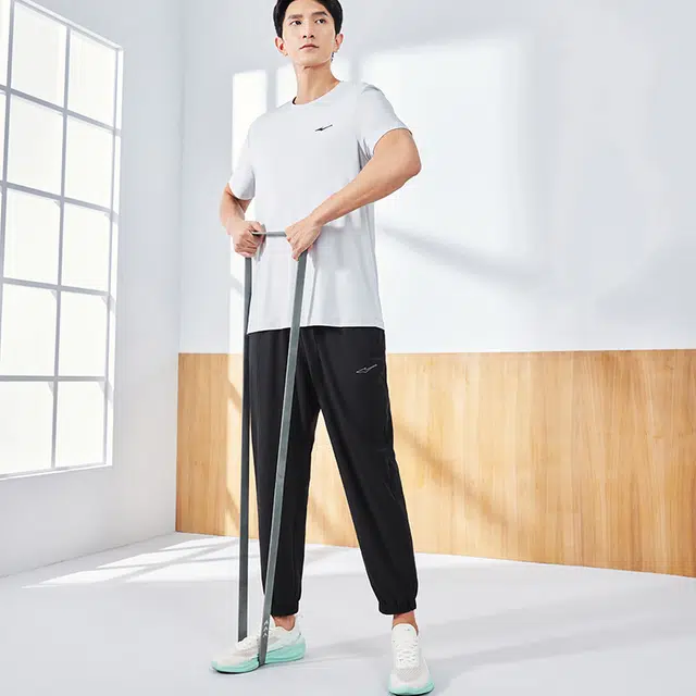鸿星尔克 吸湿速干 纯色凉感户外束脚跑步健身梭织运动休闲裤 男女同款 正黑