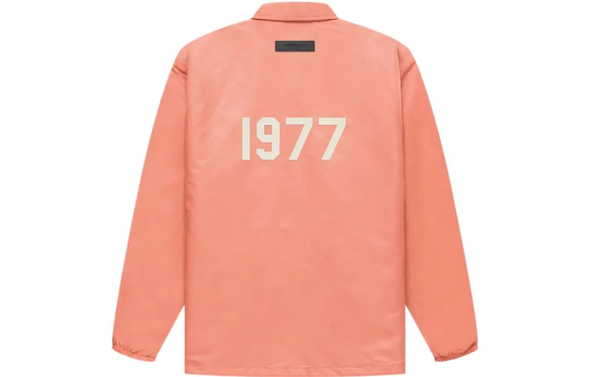 Fear of God Essentials FW22 1977 Nylon Coaches Jacket Coral Logo
